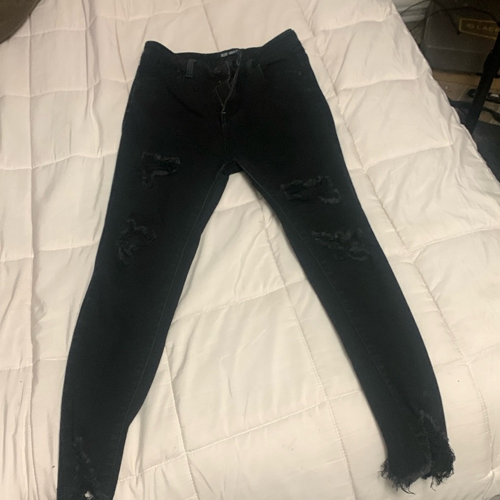 Women’s black ripped jeans